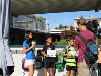 news team speaking with students