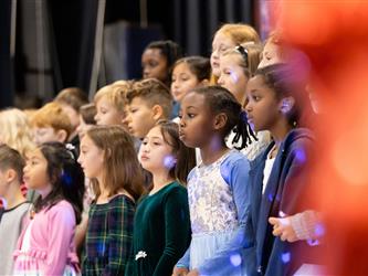 students on stage performing