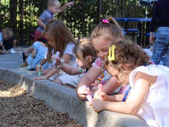 students blowing bubbles