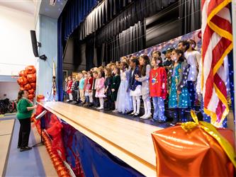 students on stage performing