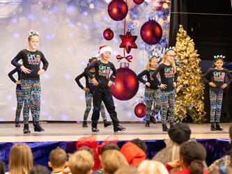 students performing on stage