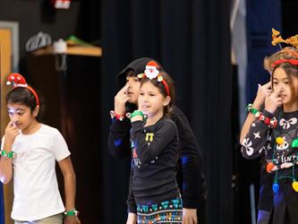 students performing on stage