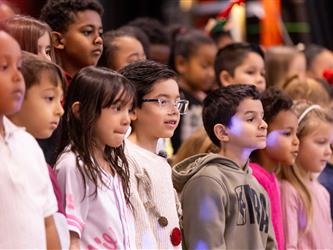 students performing on stage