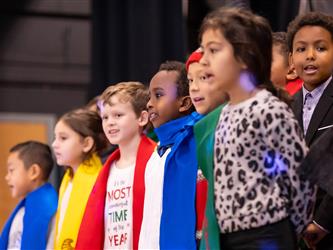 students performing on stage