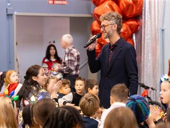 principal speaking into mic 
