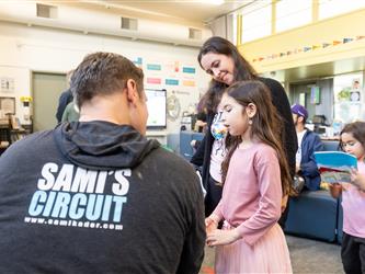 students and guests interacting with activities