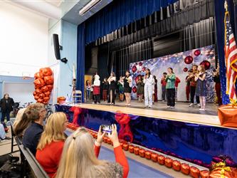 students performing on stage
