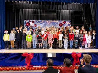 students performing on stage