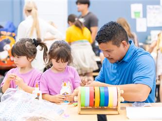 students at table with crafts