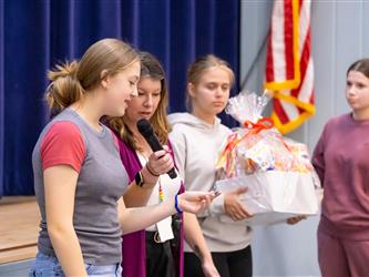student claiming their prize
