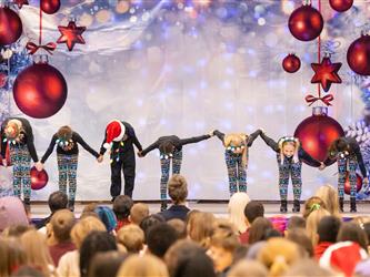 students performing on stage