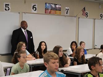 teacher addressing his class