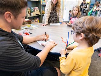 students and guests interacting with activities