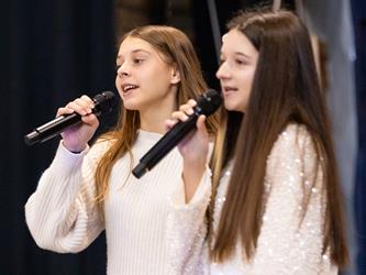 students performing on stage