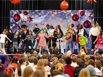 students on stage performing