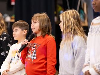 students on stage performing