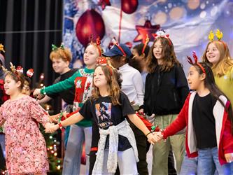 students performing on stage