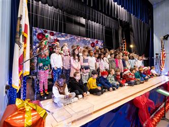 students performing on stage