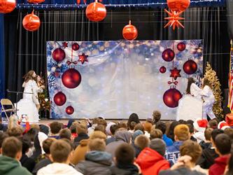 students performing on stage