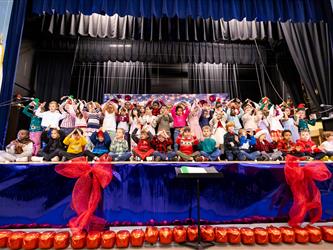 students performing on stage