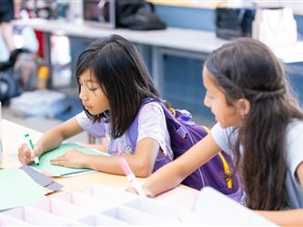 students at table with crafts