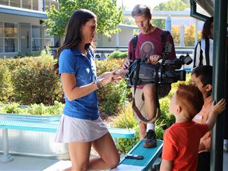 news team speaking with students