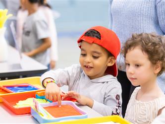 students and guests interacting with activities