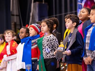 students performing on stage