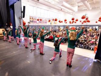students performing on stage