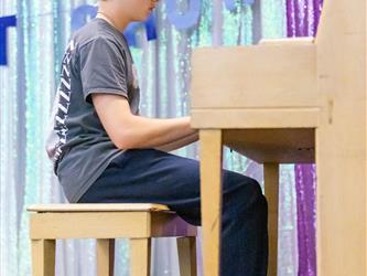 performer playing piano