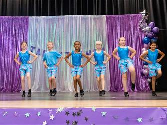 group of performers dancing