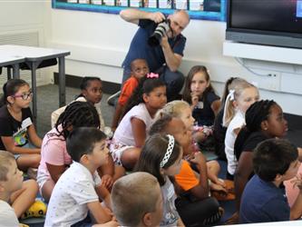 students listening to teacher in class