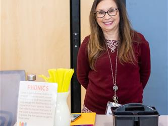 woman smiling at booth