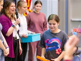 student claiming their prize
