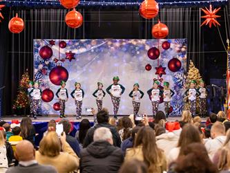 students performing on stage