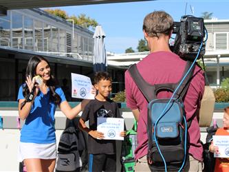 news team speaking with students