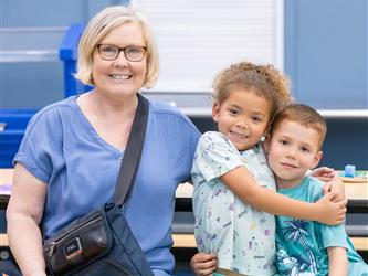 mother and two children posing 
