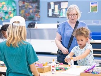 students at table with crafts