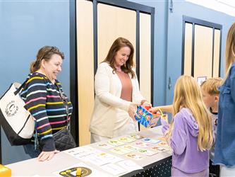 students and guests interacting with activities