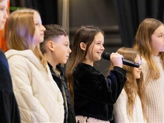students performing on stage
