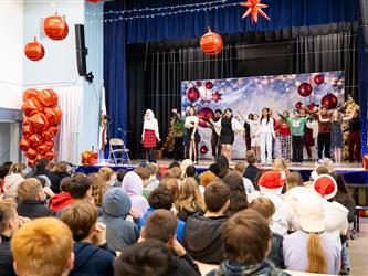 students performing on stage
