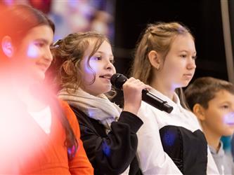 students performing on stage