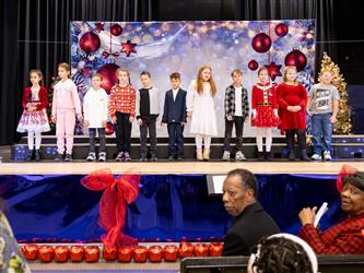 students performing on stage