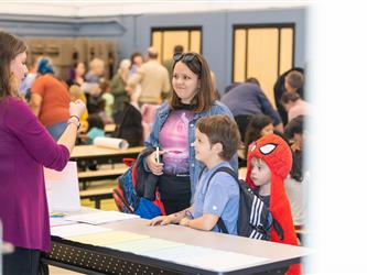 students and guests interacting with activities