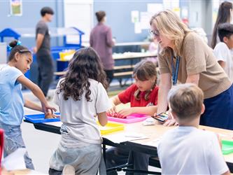 students at table with crafts