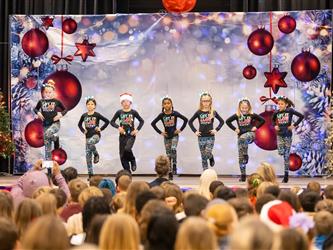 students performing on stage