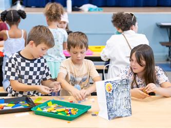 children making crafts at table 