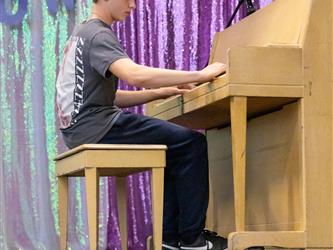 performer playing piano