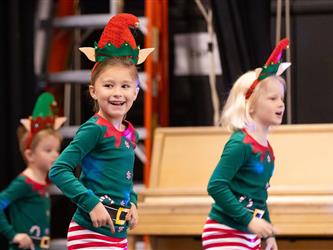 students performing on stage
