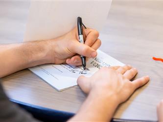 shot of hands writing 